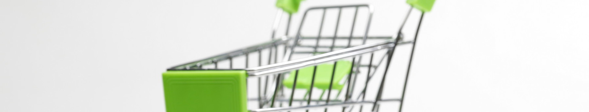 clanki/coins-pile-shopping-cart-white-background